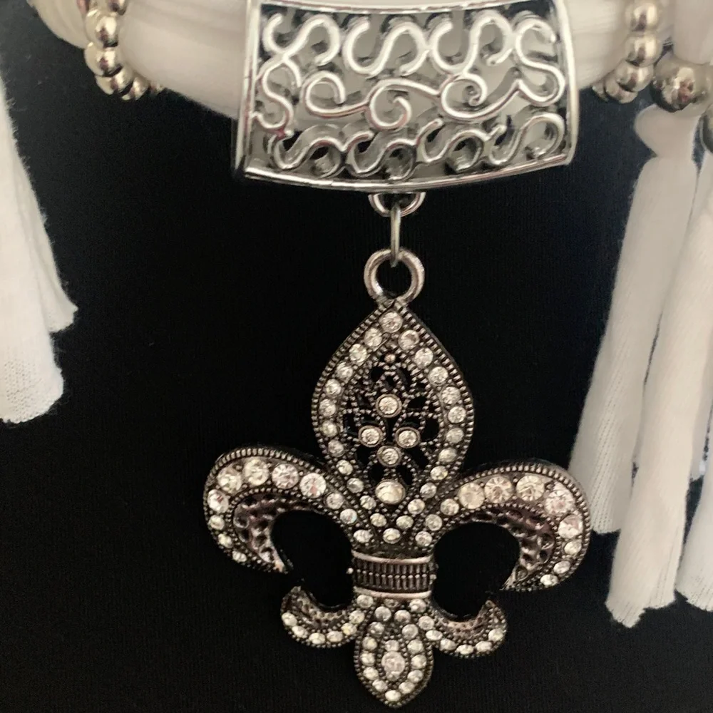 NWOT Chic White Scarf Necklace with Fleur-de-Lis Pendant.